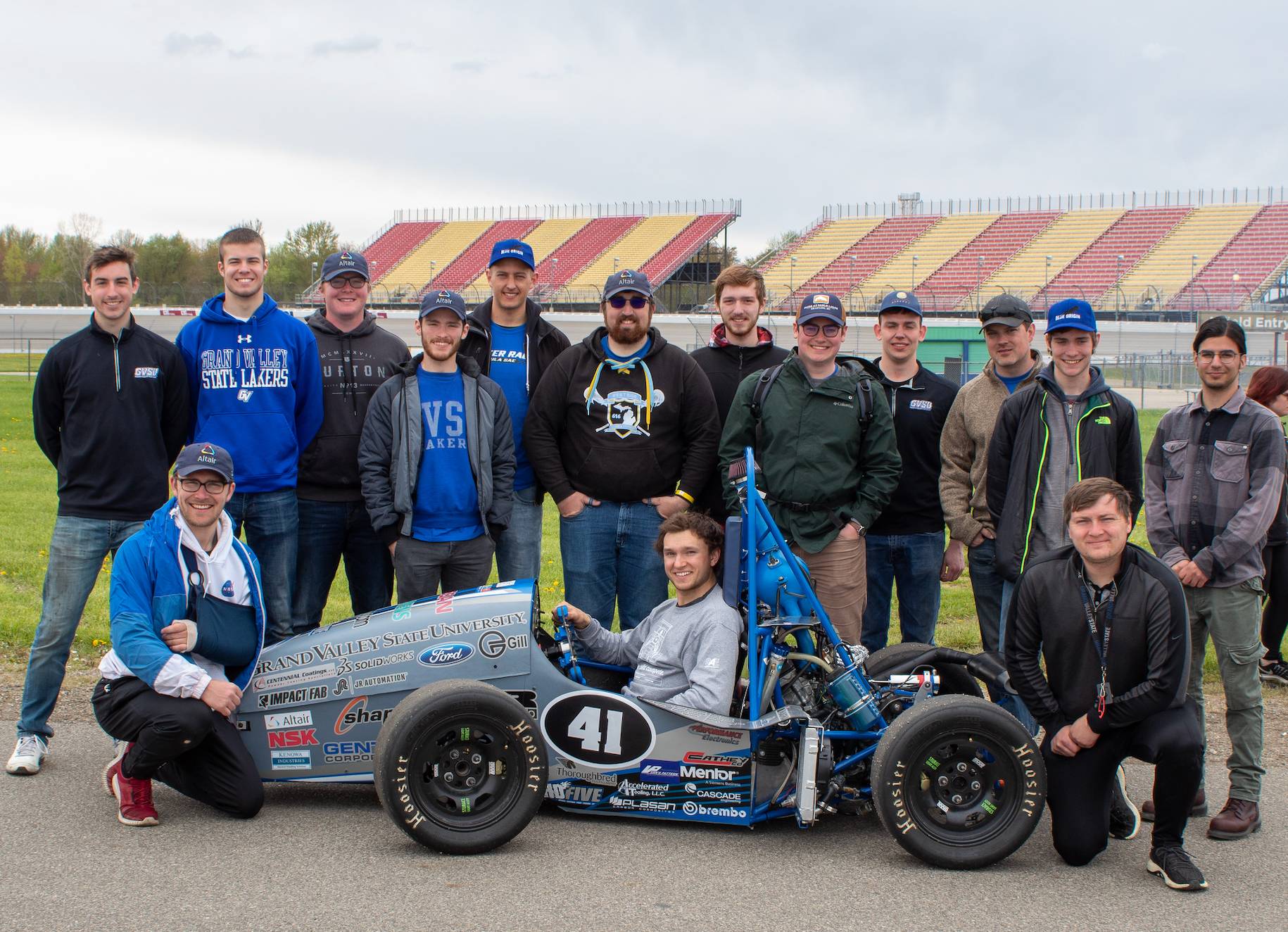 Team in front of SAE Formula one car
